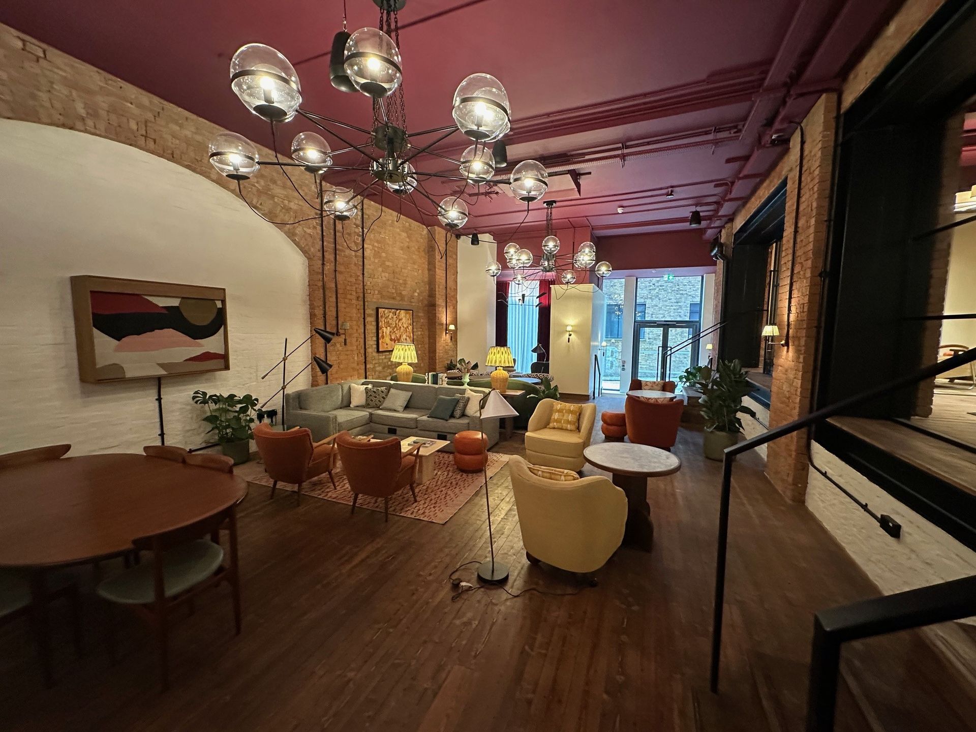 A large room with a red ceiling and lots of furniture
