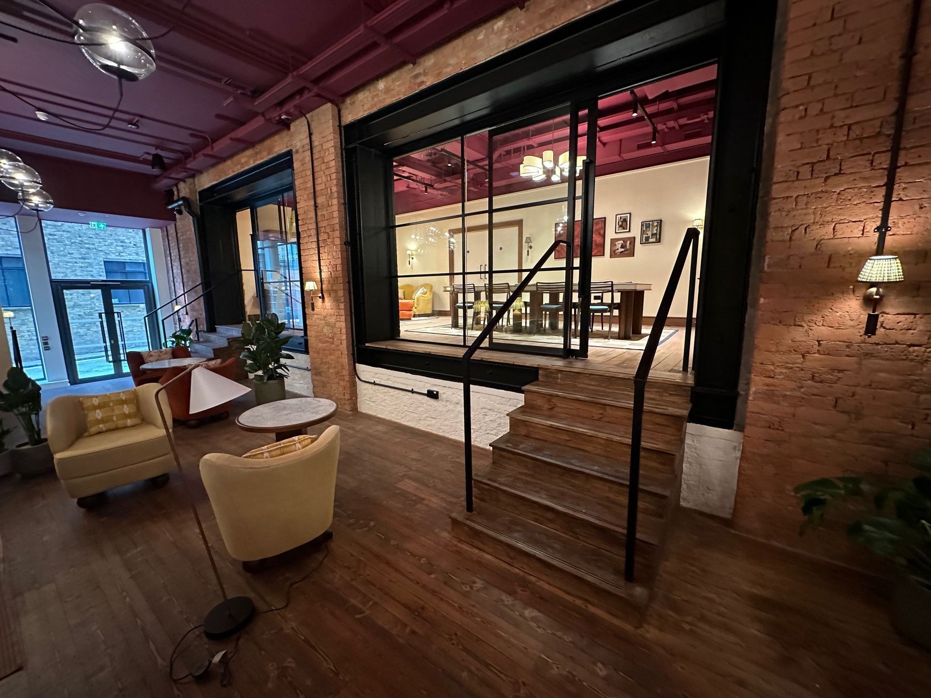 There are stairs leading up to the second floor of the building.