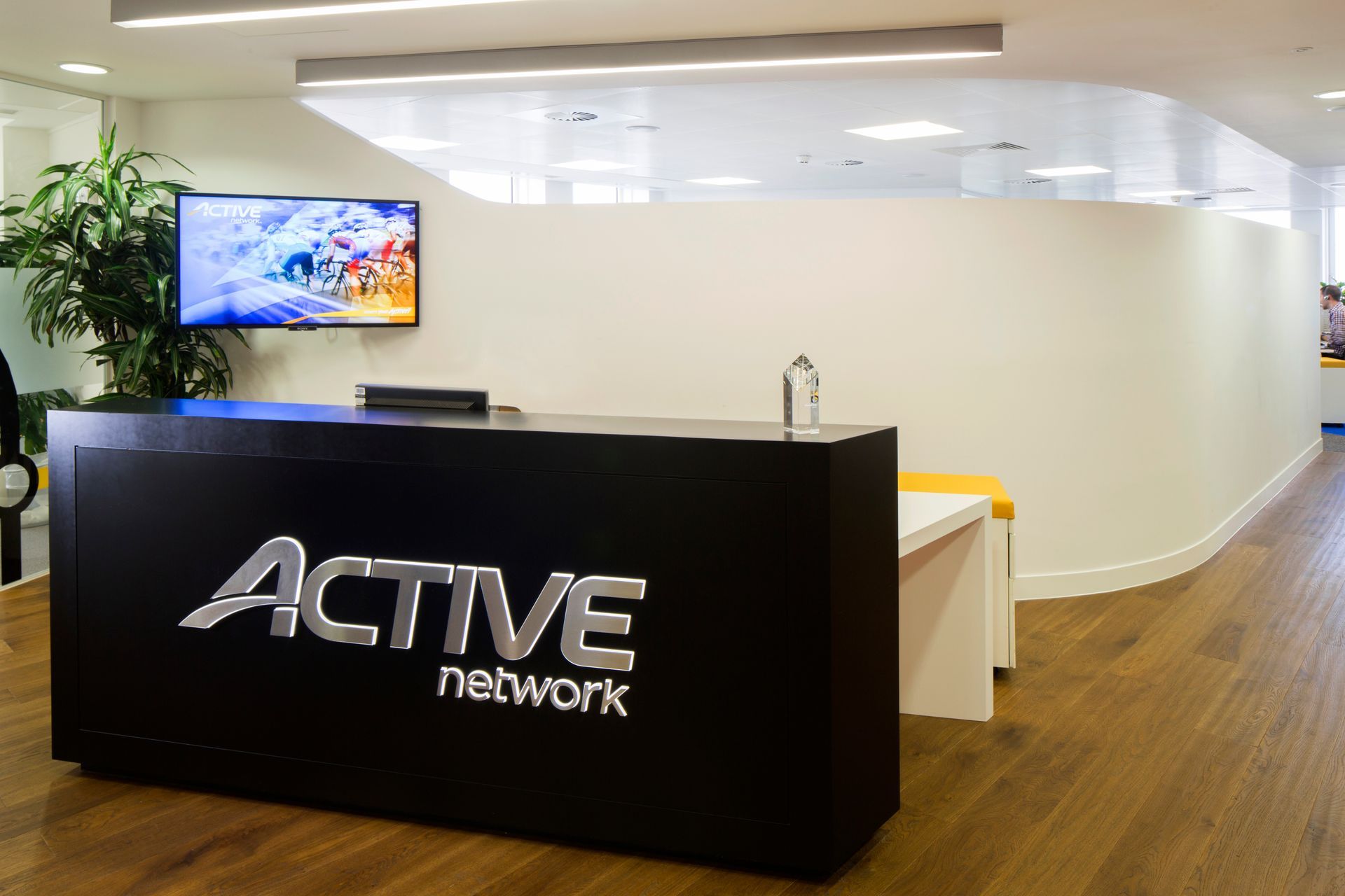 Active Network with Stained and Lacquered Flooring Reception Desk close up