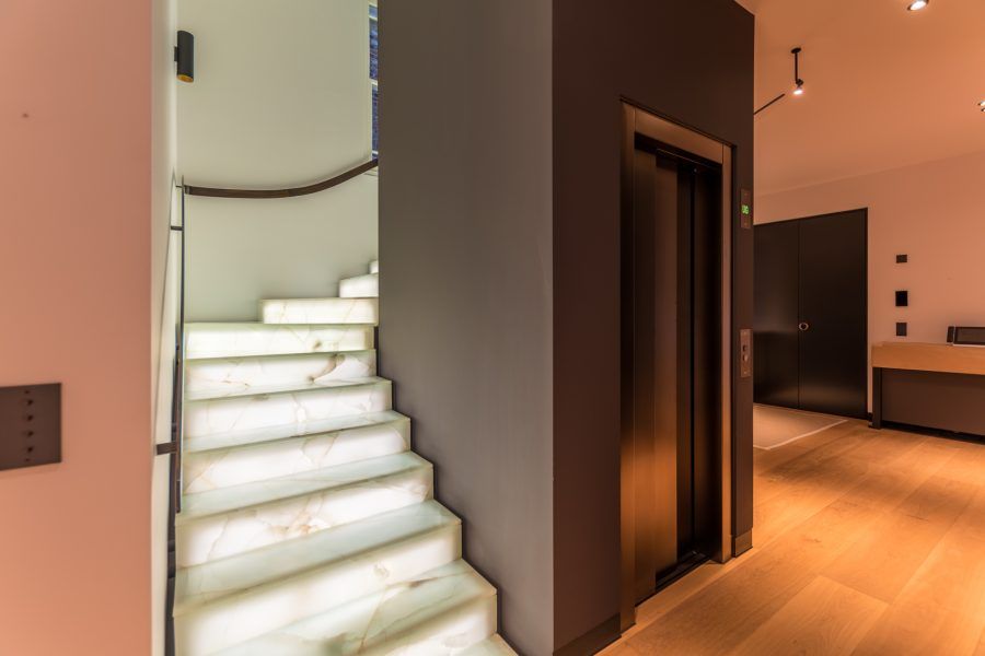 Bespoke Oil flooring at bottom of stairs at Private Residence in Kensington