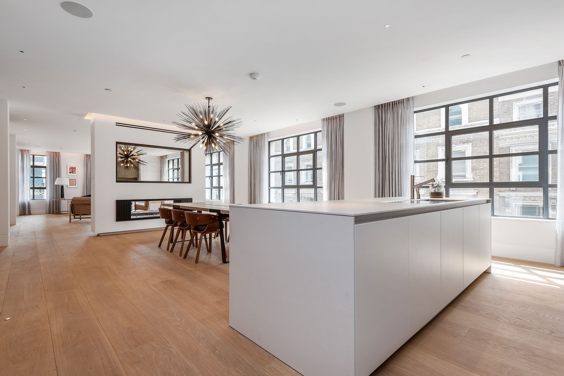 Brushed and Bespoke Coloured Oil flooring in dining room of Westbourne Lofts