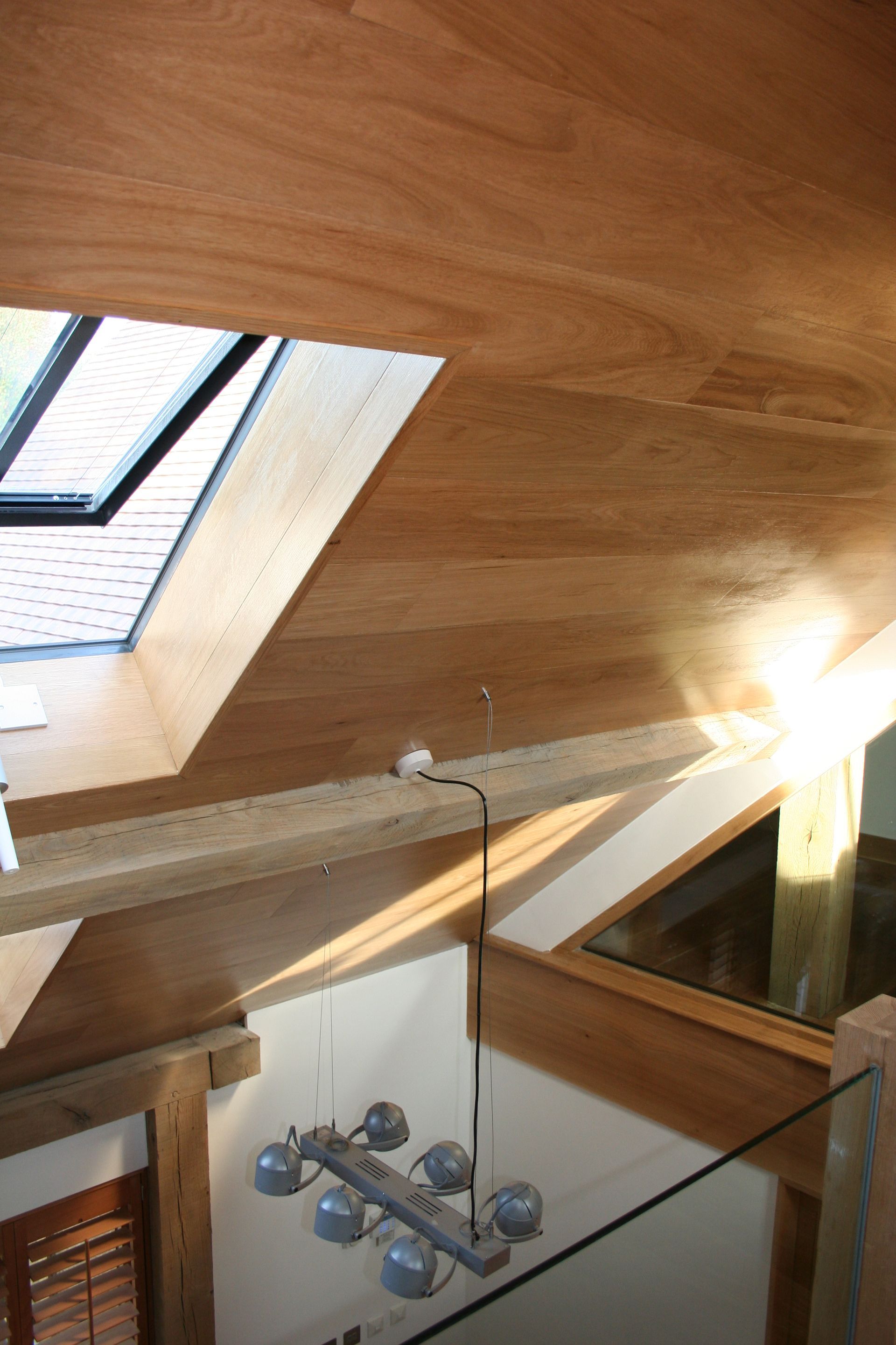 Pinner slanted ceiling cladded with Oak Parquet
