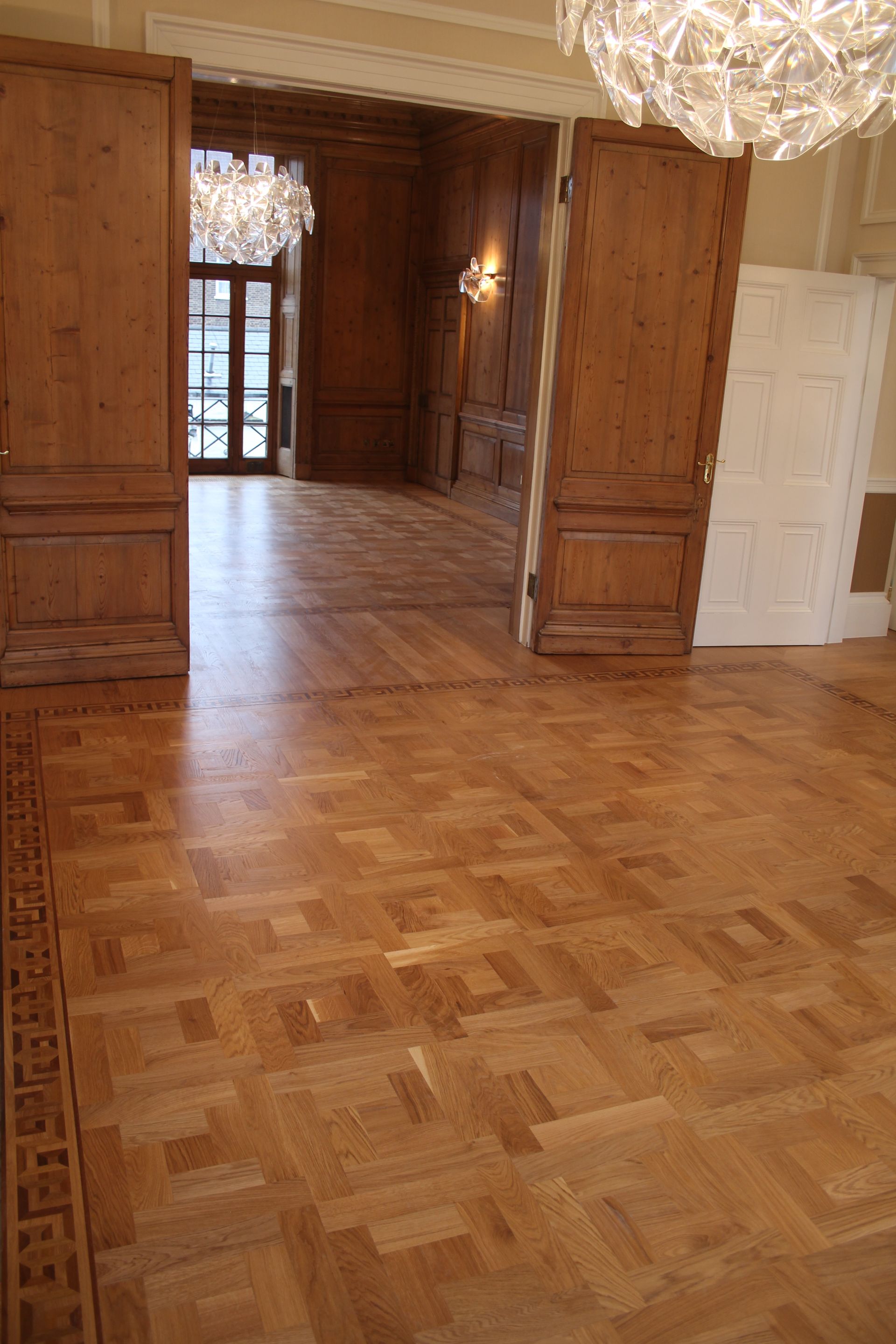 Prime Grade Oak Parquet seamless flooring between rooms at residence in Baker Street, London