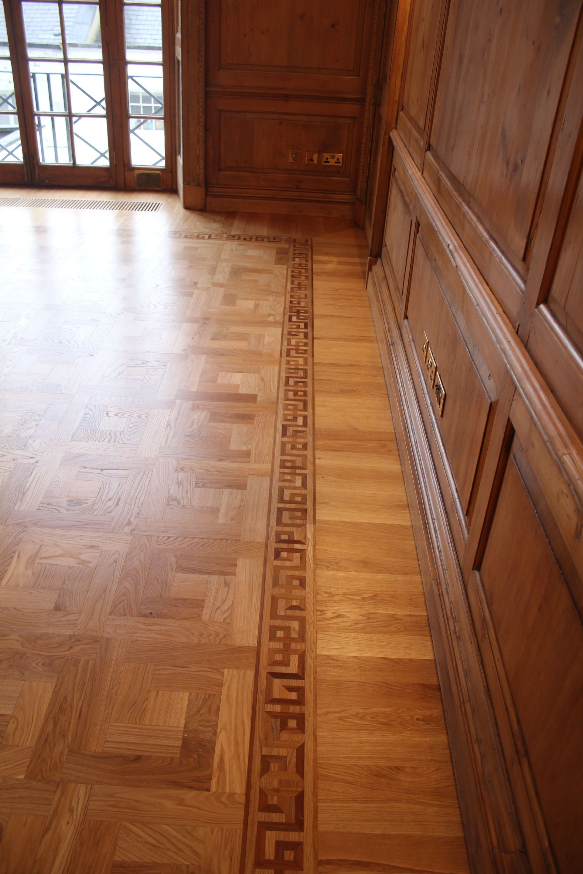 Light shining off of Prime Grade Oak Parquet flooring at residence in Baker Street, London