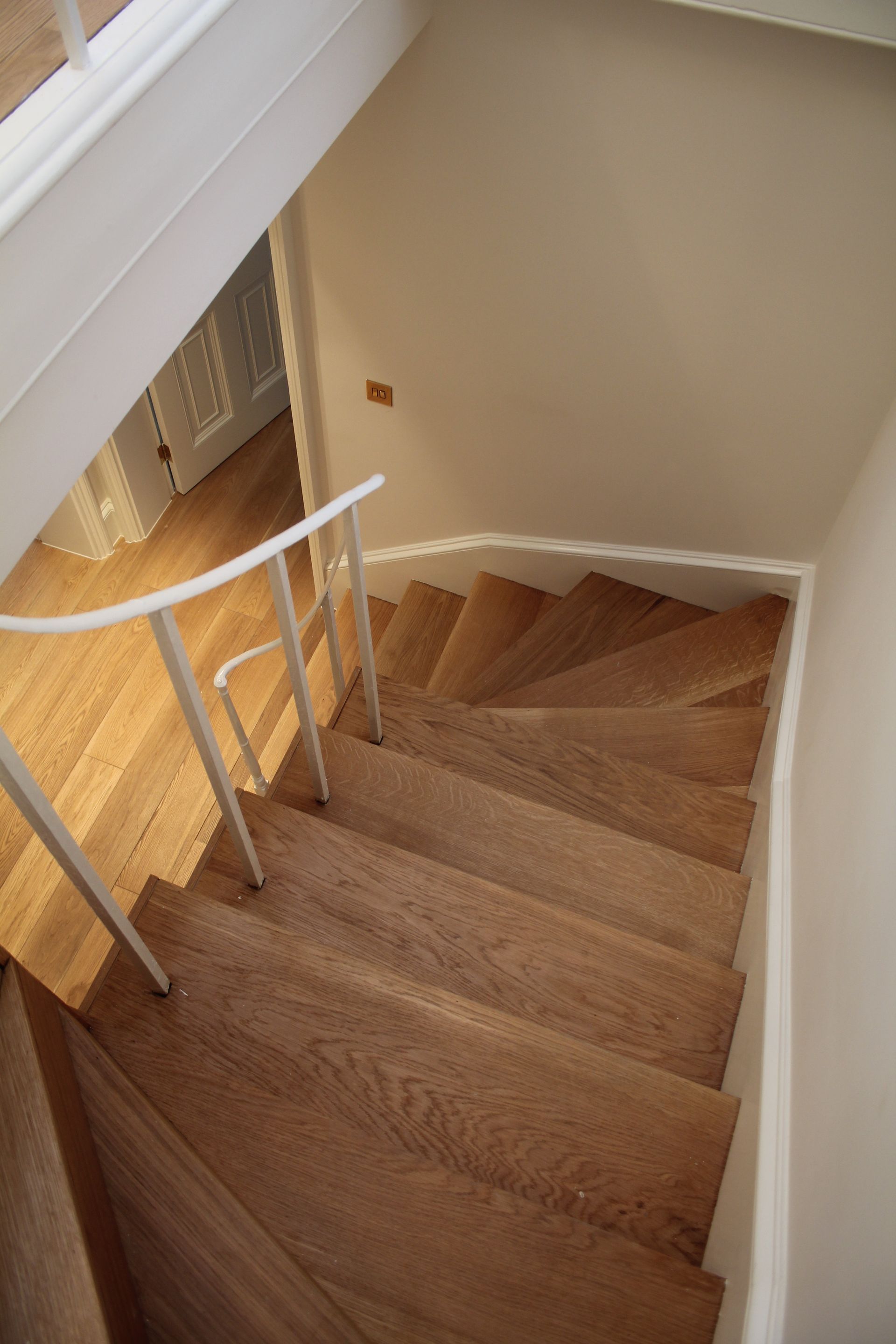 Staircase in Baker Steet residence, London, cladded with Prime Grade Oak Parquet