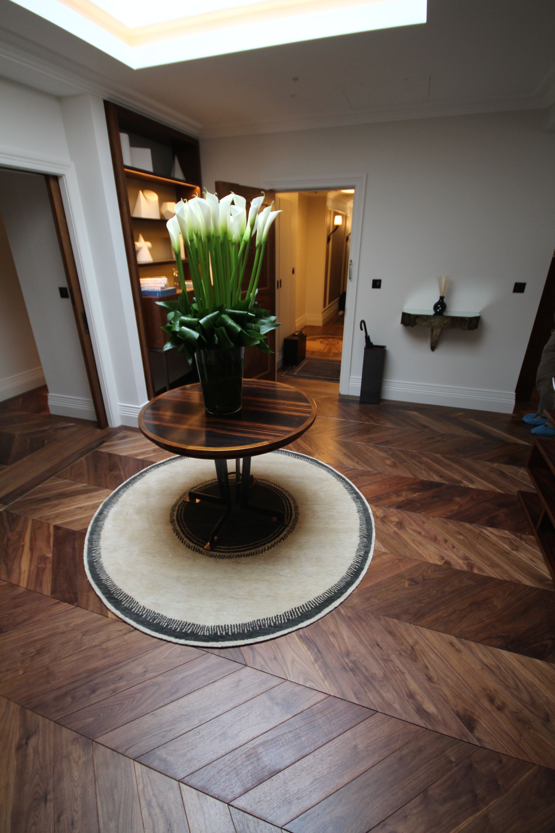 Reception area with prime grade walnut flooring at The Arts Club in Mayfair