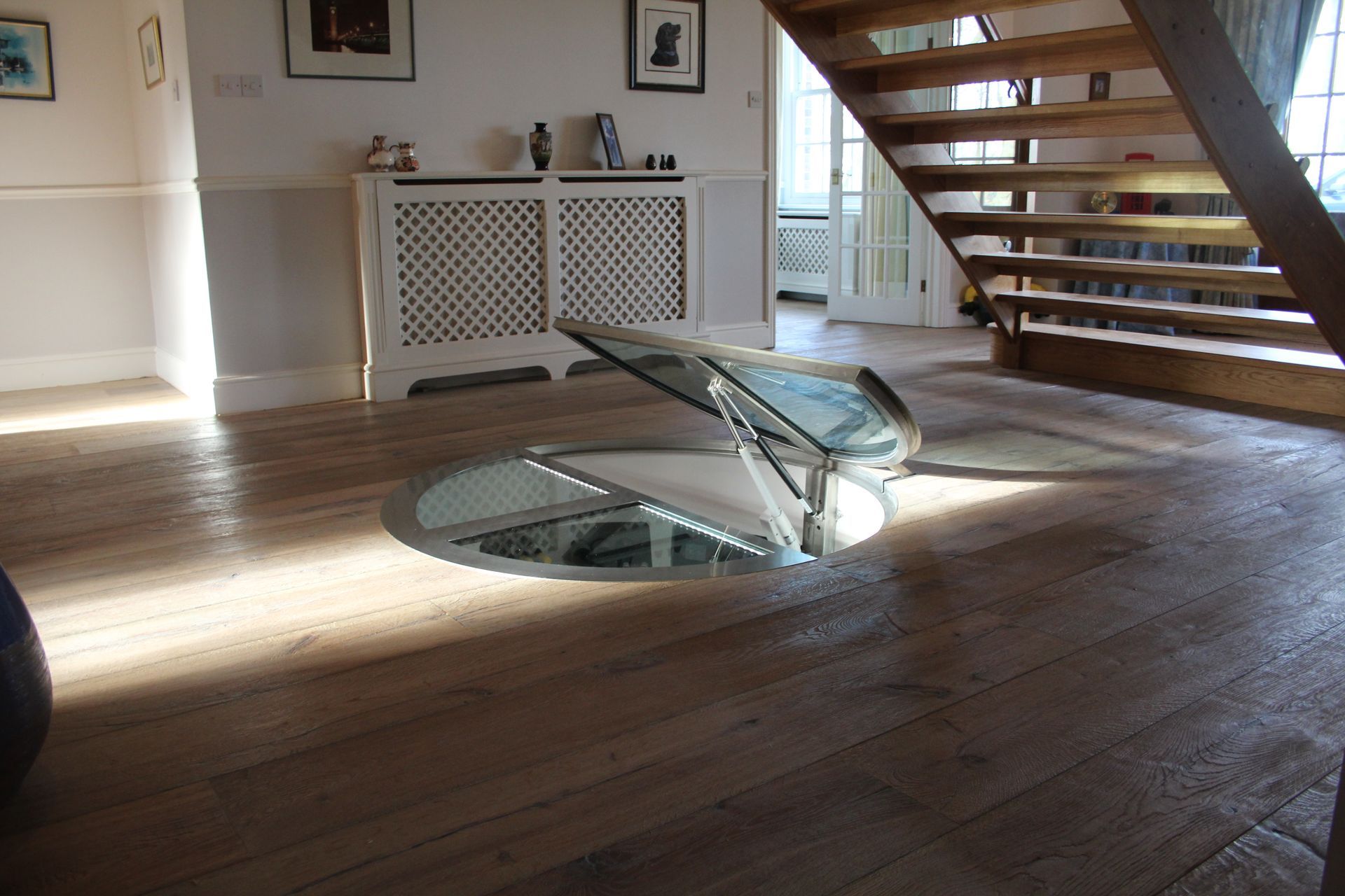 Private residence with open entrance to wine cellar, surrounded by finished flooring