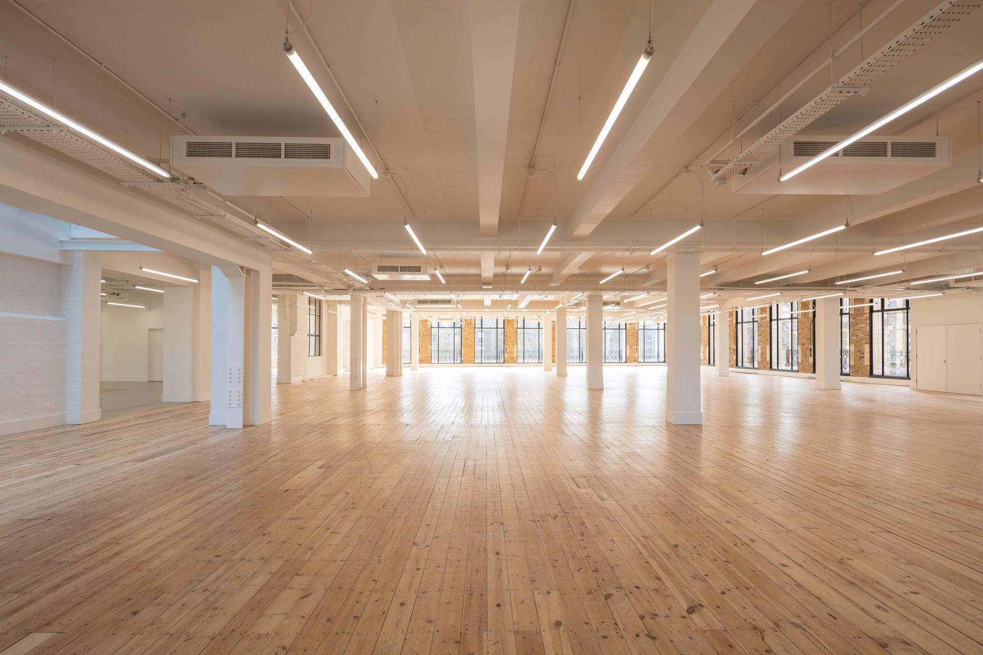 Large open room in private building with finished flooring