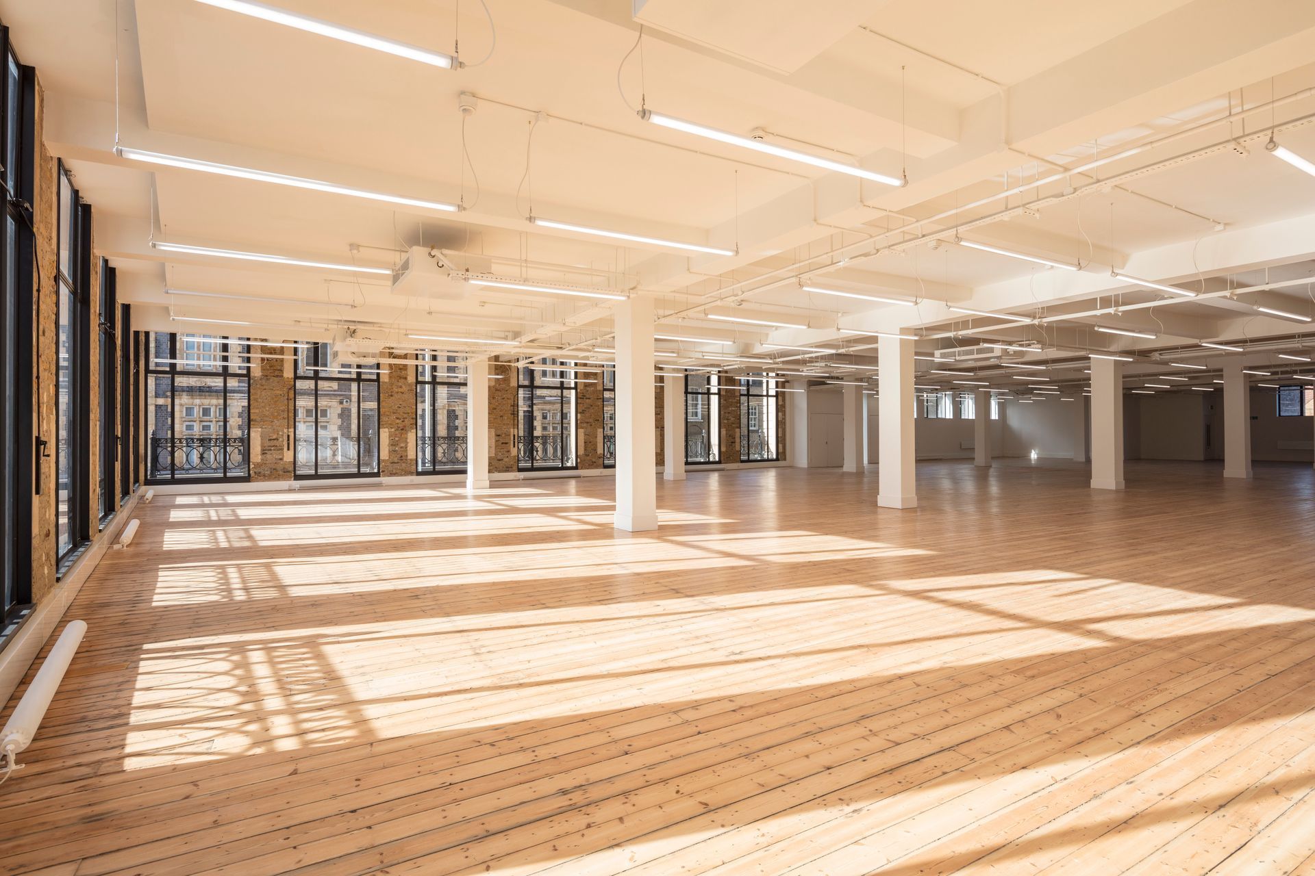 Light shining through windows onto Clear Polyurethane Lacquer flooring at Department W