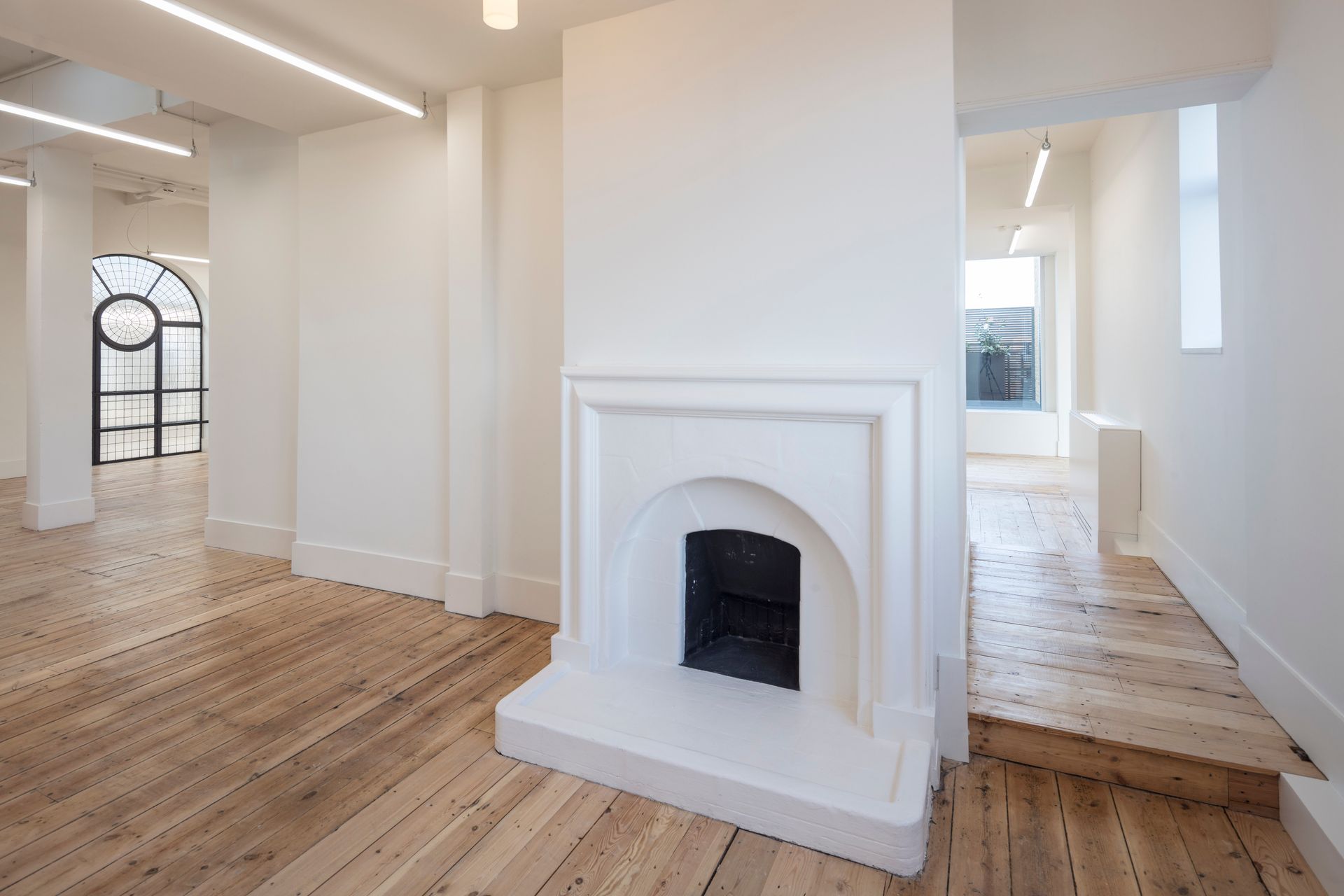 Room with fireplace at Department W finished with Clear Polyurethane Lacquer flooring