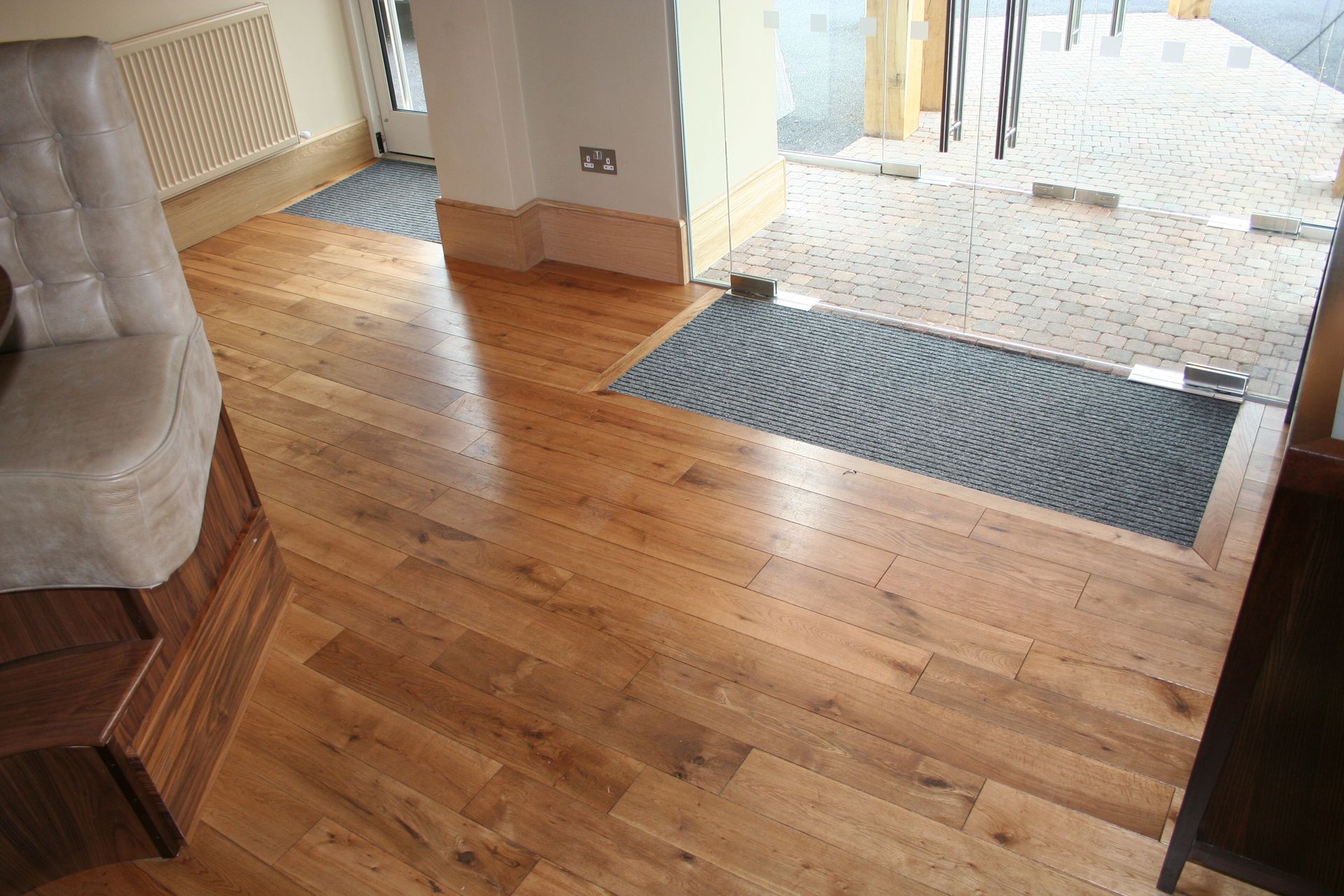 Entrance flooring fitted with Character Grade Oak with Walnut Finish at the Public House in Essex