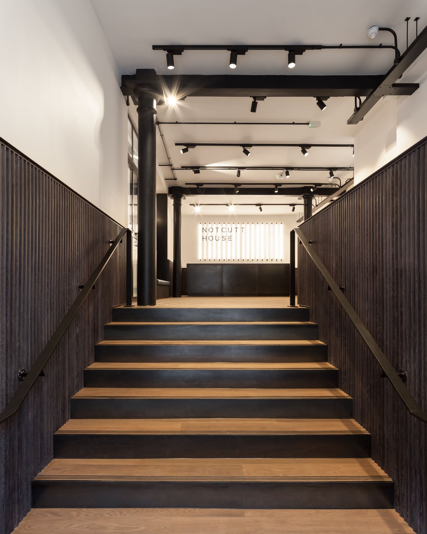 A set of stairs leading up to a large room