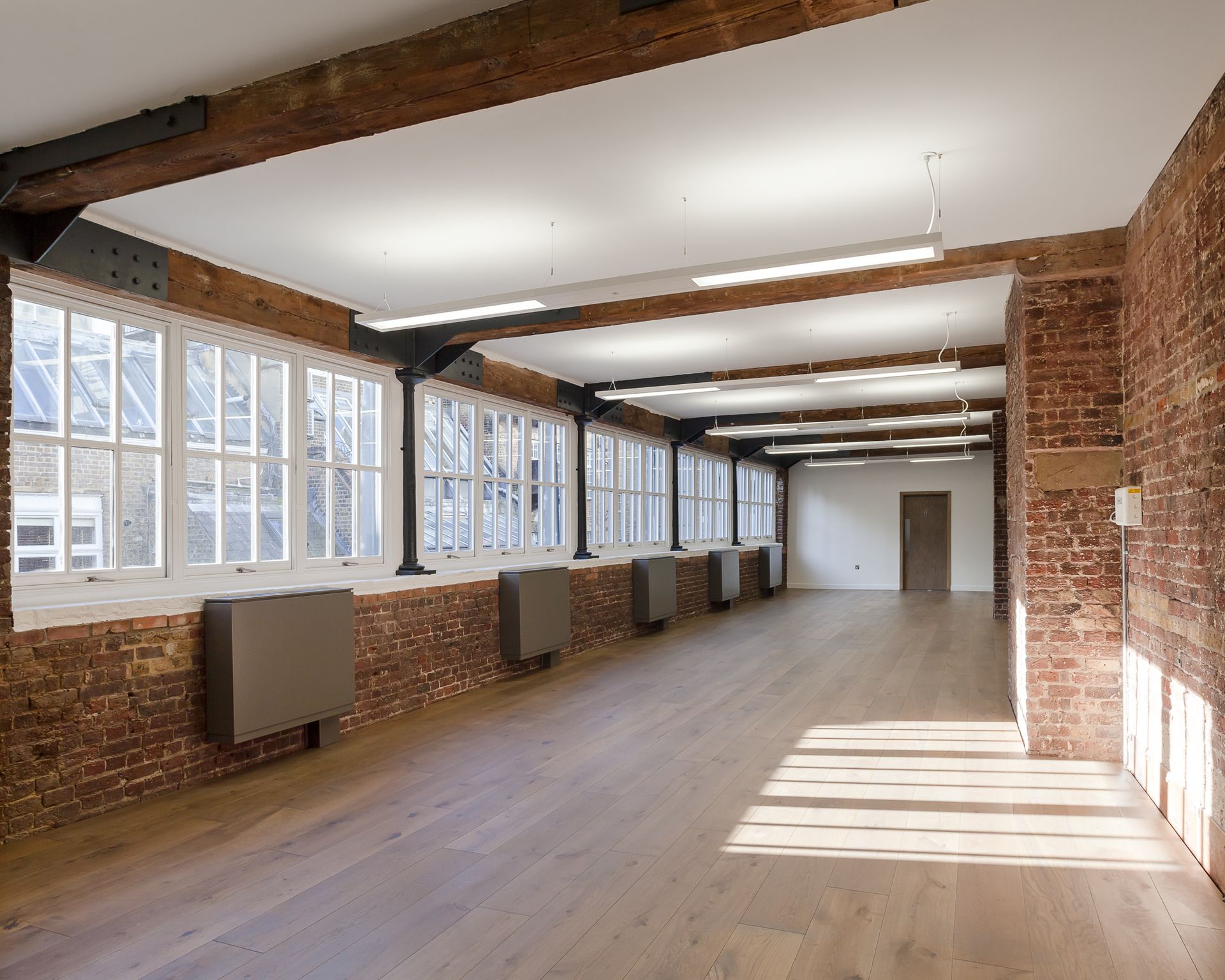 Long hall at Beak Street fitted with Oiled Oak Flooring