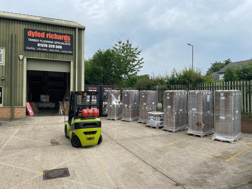 Forklift sat outside warehouse