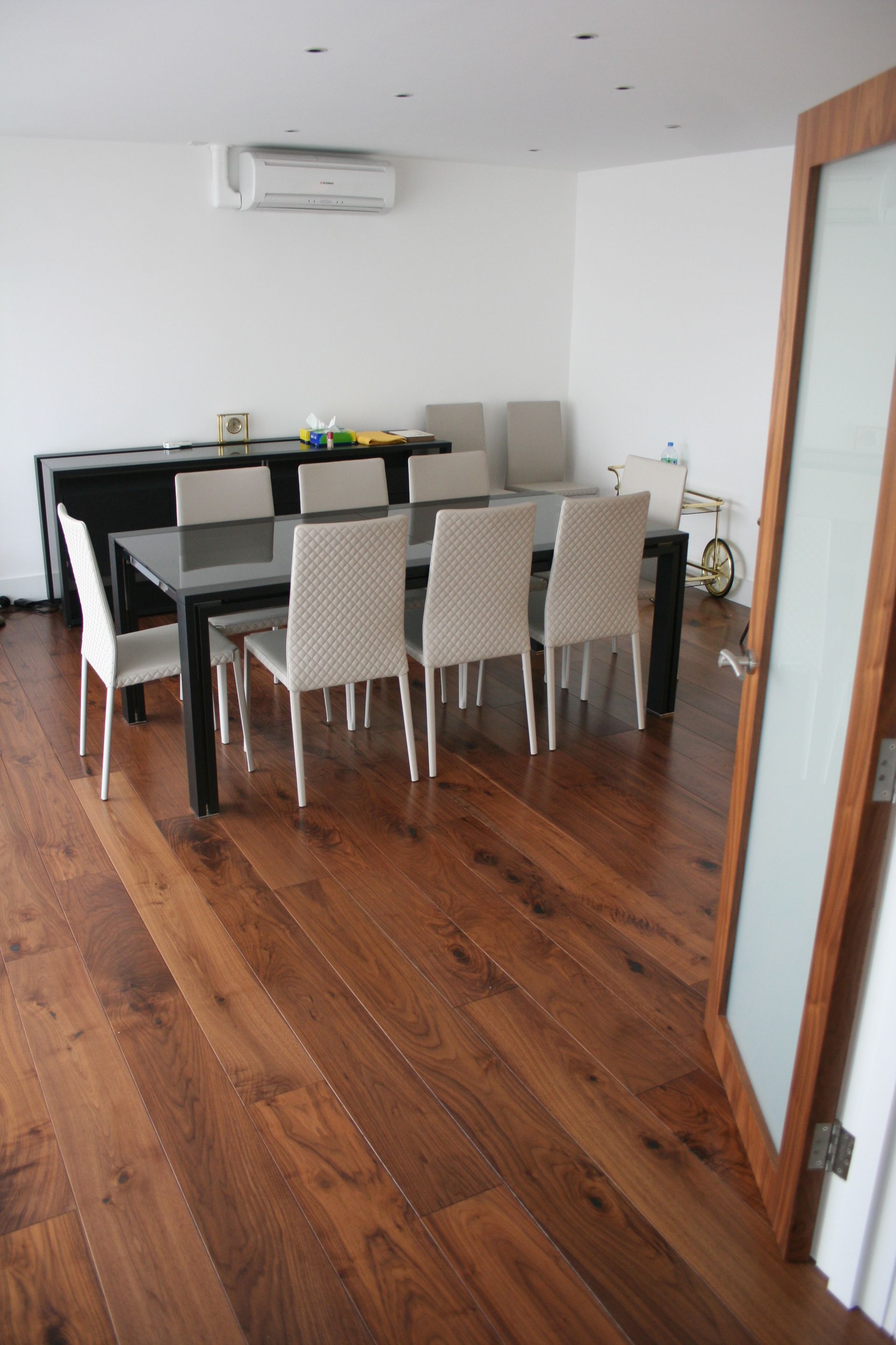 Multi Layered Prefinished Lacquered Walnut flooring fitted in Bayswater Dining Room