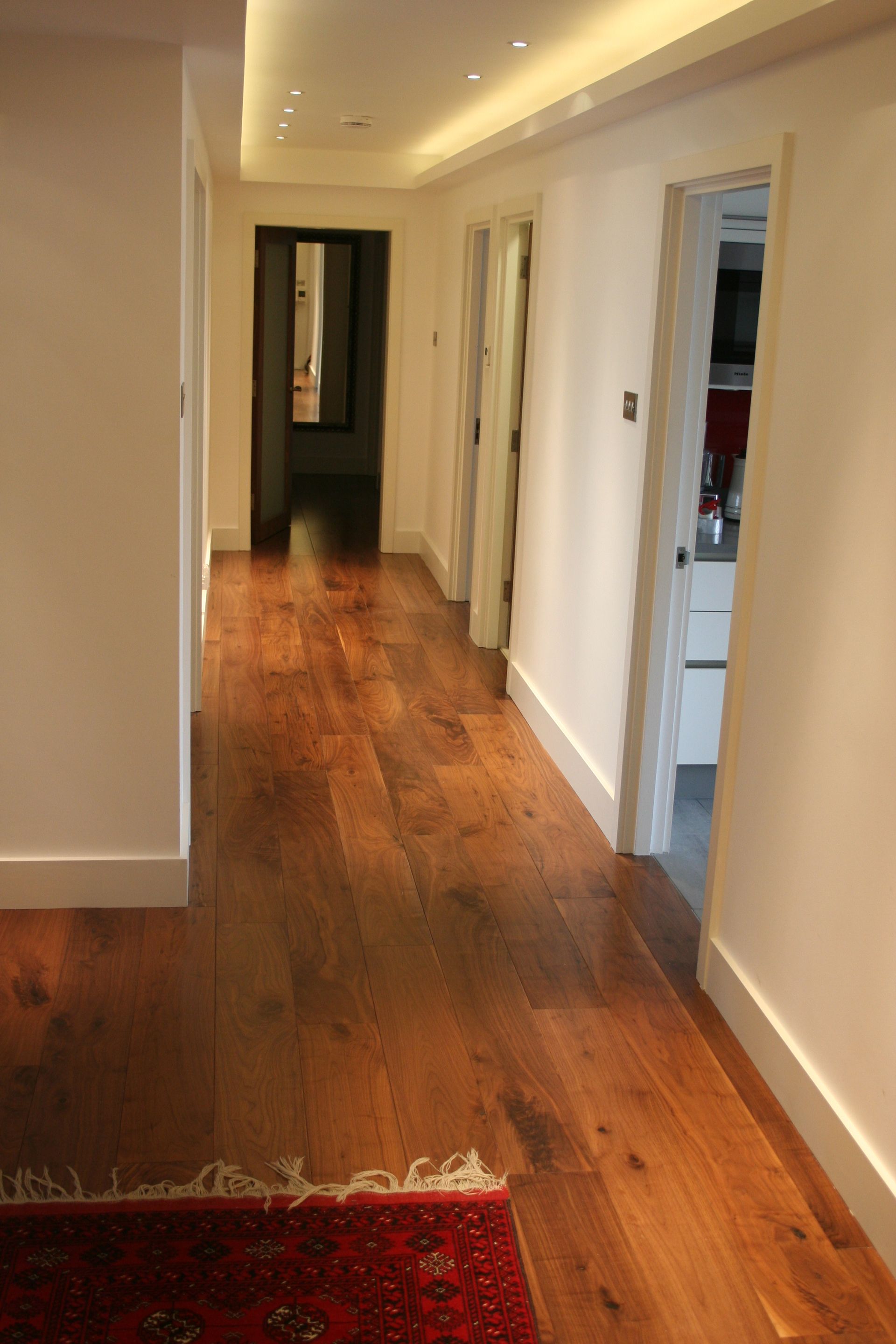 Baywater hallway fitted with Multi Layered Prefinished Lacquered Walnut flooring