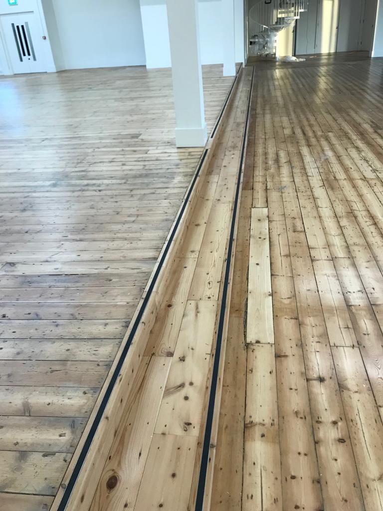 Close up of tread inserts on reclaimed pine staircase fitted by Dyfed Richards
