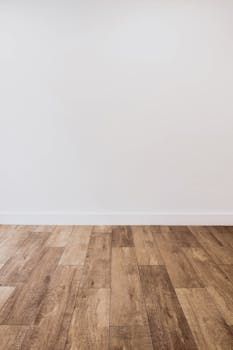 Wooden floor and white wall in Manchester.