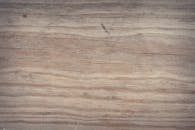 Wood grain texture, horizontal light brown planks.