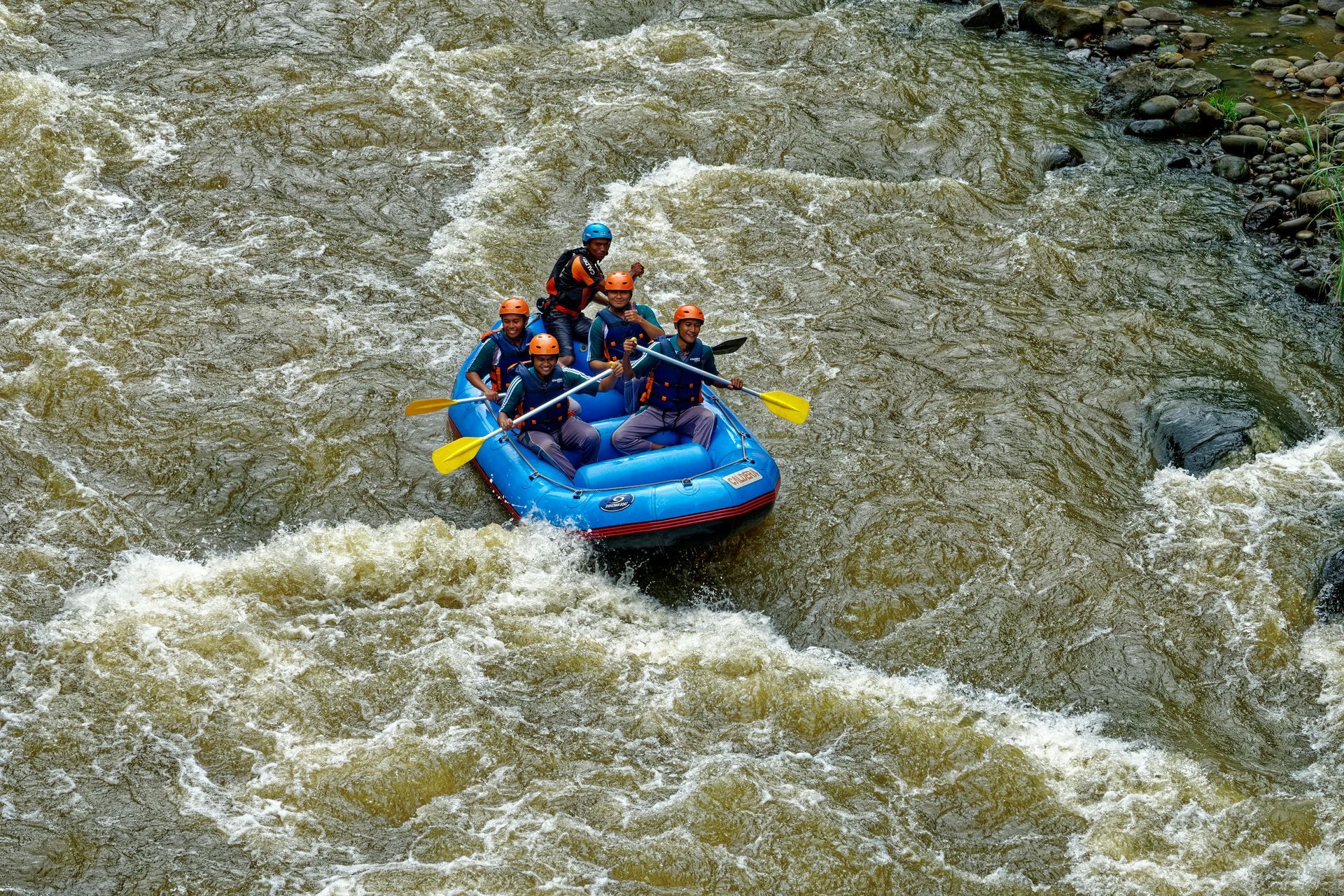 A group of people are rafting down a river.