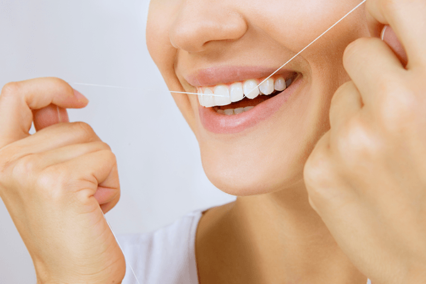 Flossing Teeth - Christiana Pleasant Dental