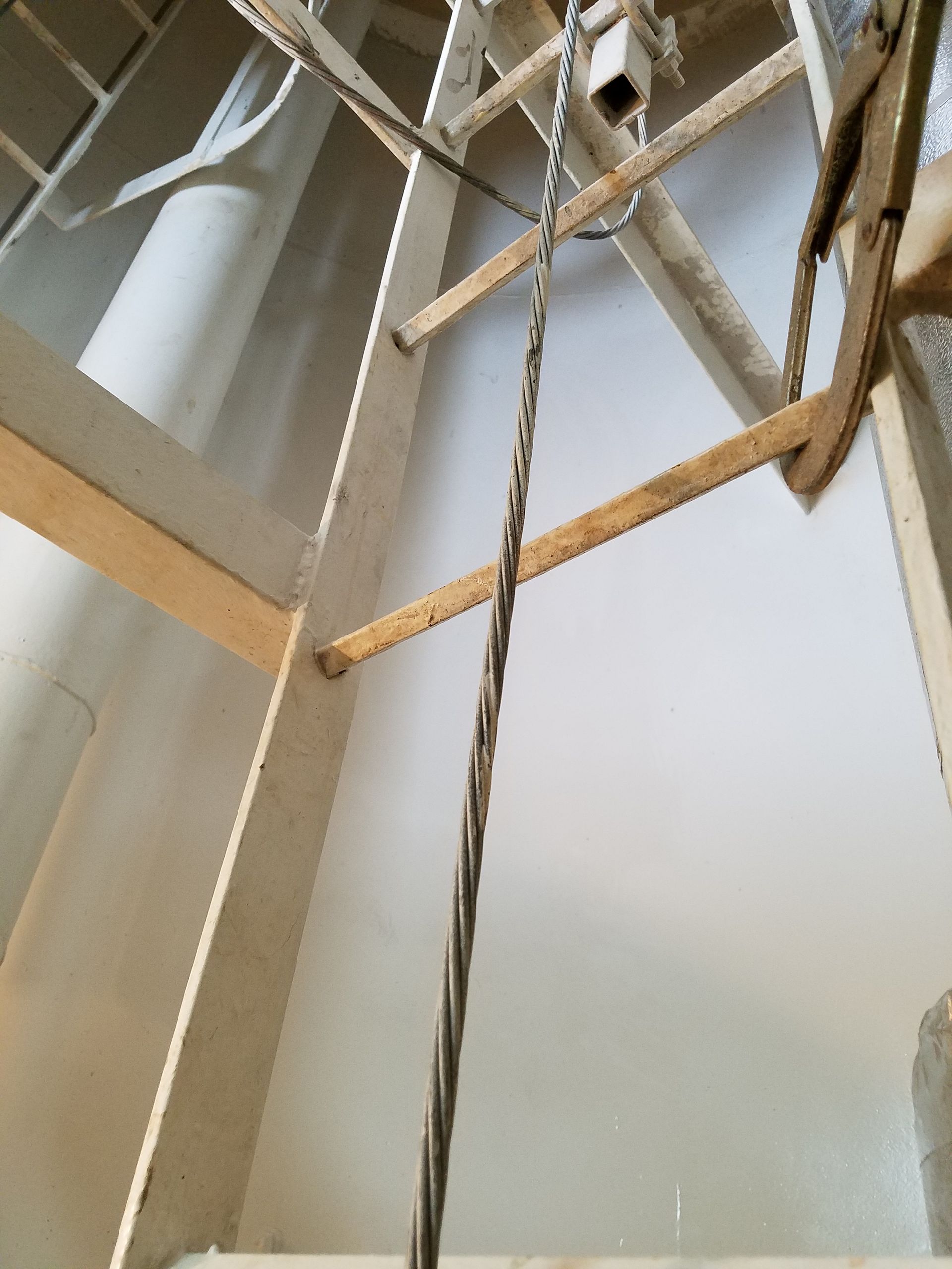 A rope is hanging from the ceiling in a room