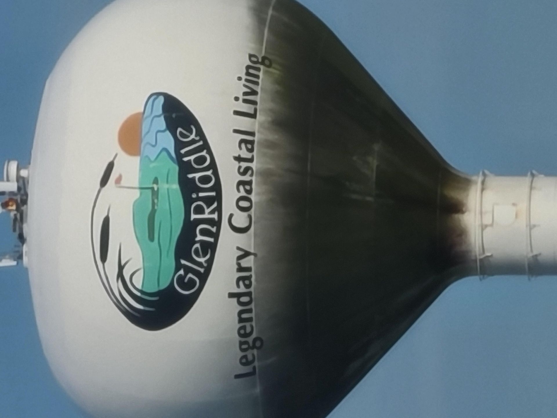 A water tower that says glen riddle legendary coastal living