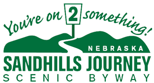 A logo for sandhills journey scenic by way in nebraska