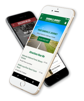 Two smartphones displaying travel app content. One is white, one is black.