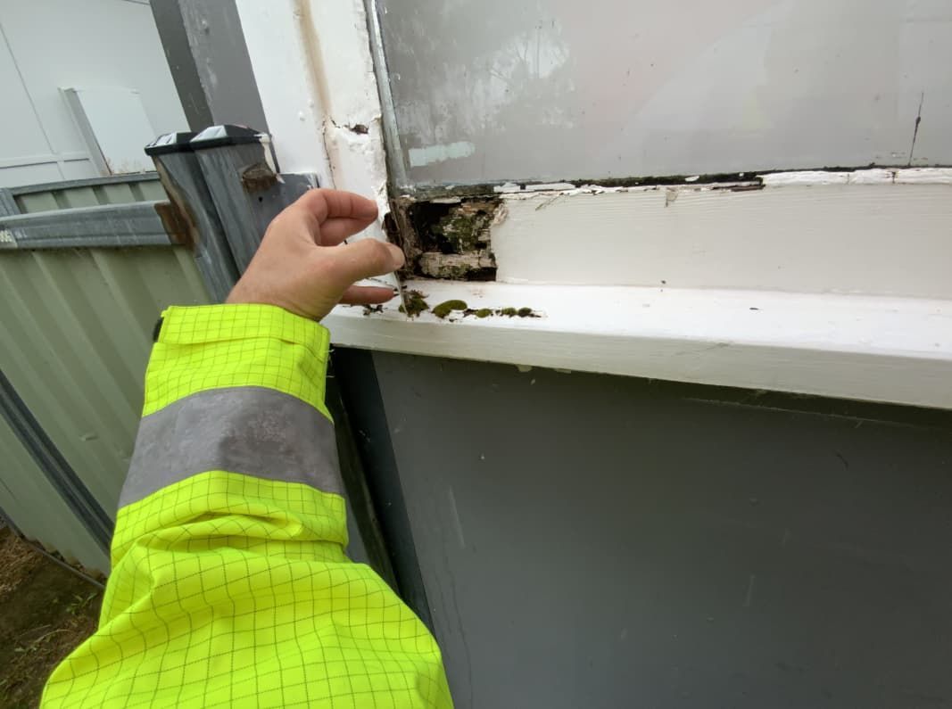A Brick Column Is Sitting Under A Wooden Deck — Able Building and Pest Inspections In Coffs Harbour, NSW