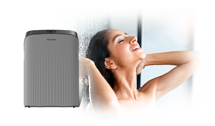 Gray shower unit next to woman enjoying a shower.