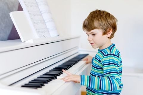 Young Boy Playing Piano - Piano Service