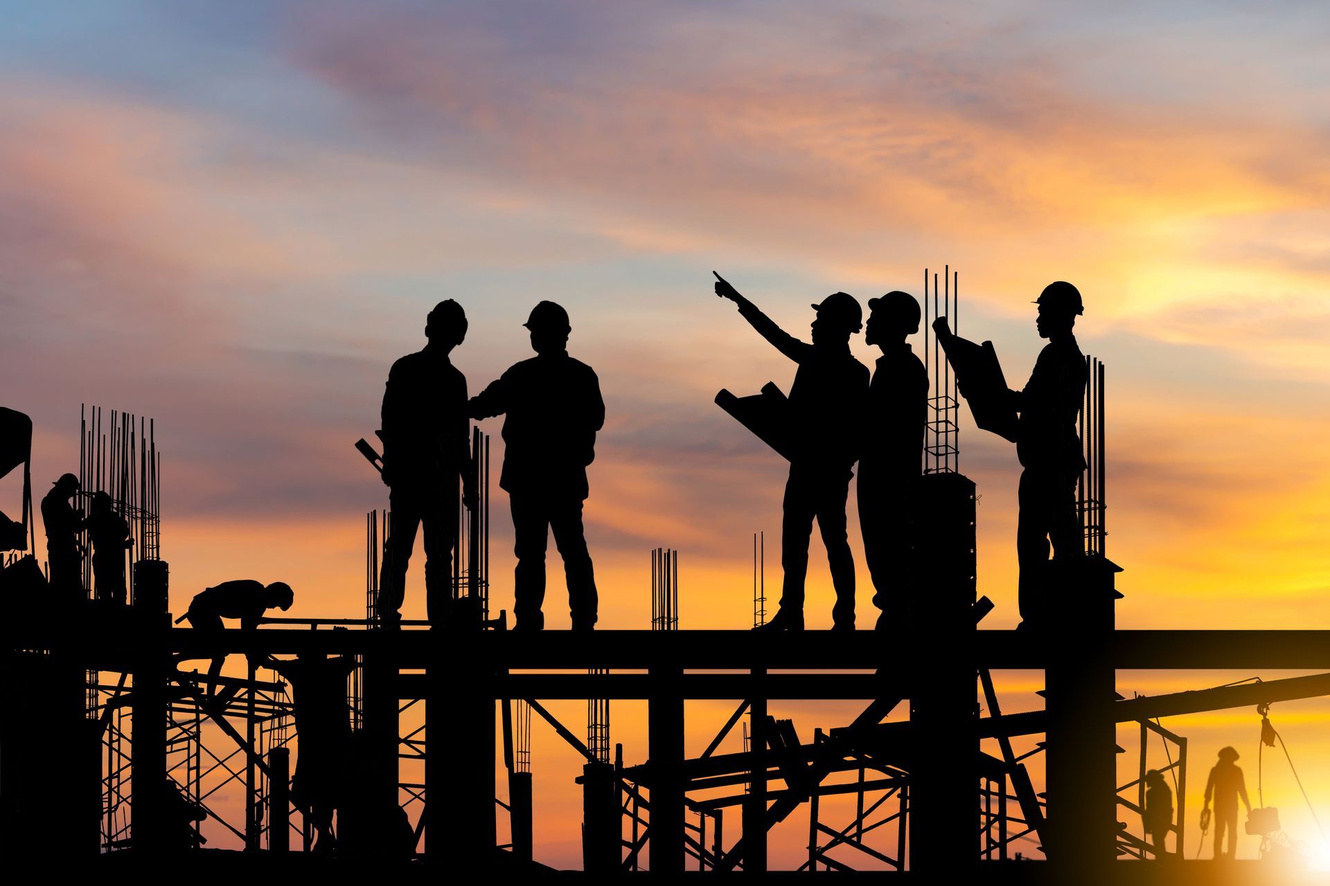 Silhouette Of Engineer And Worker On Building Site