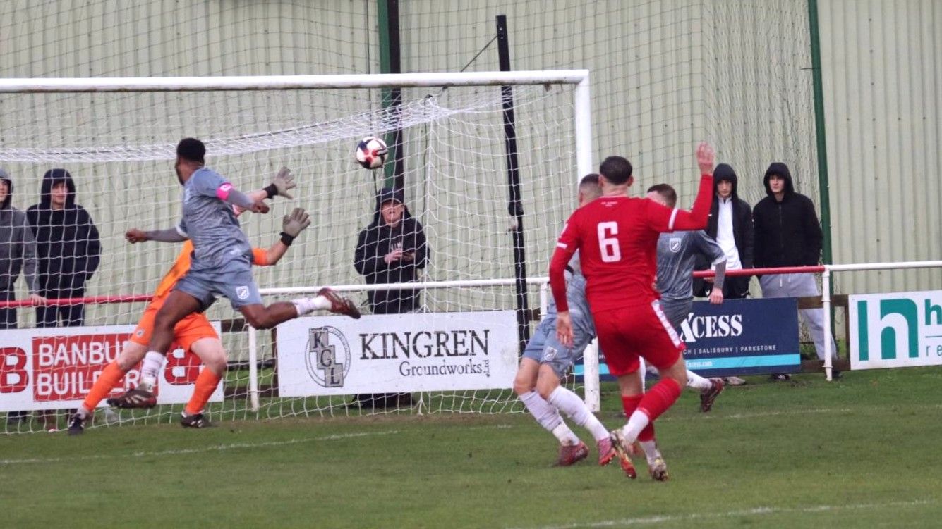 Robins' captain, Sam Davidson fires home Downton's opener in their 3-0 FA Vase triumph over Lymore Gardens (Photo: Steve Ross | Those White Lines)