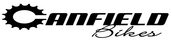 A black and white logo for canfield bikes with a gear on it.