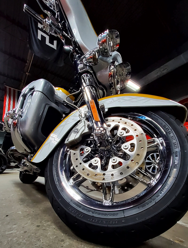 A close up of the front wheel of a motorcycle