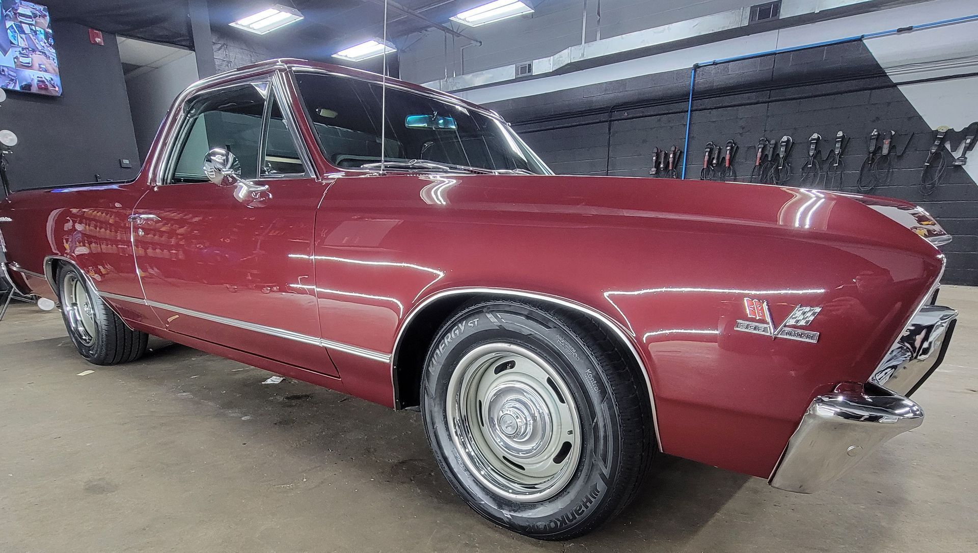 A man is applying window tinting to a car door