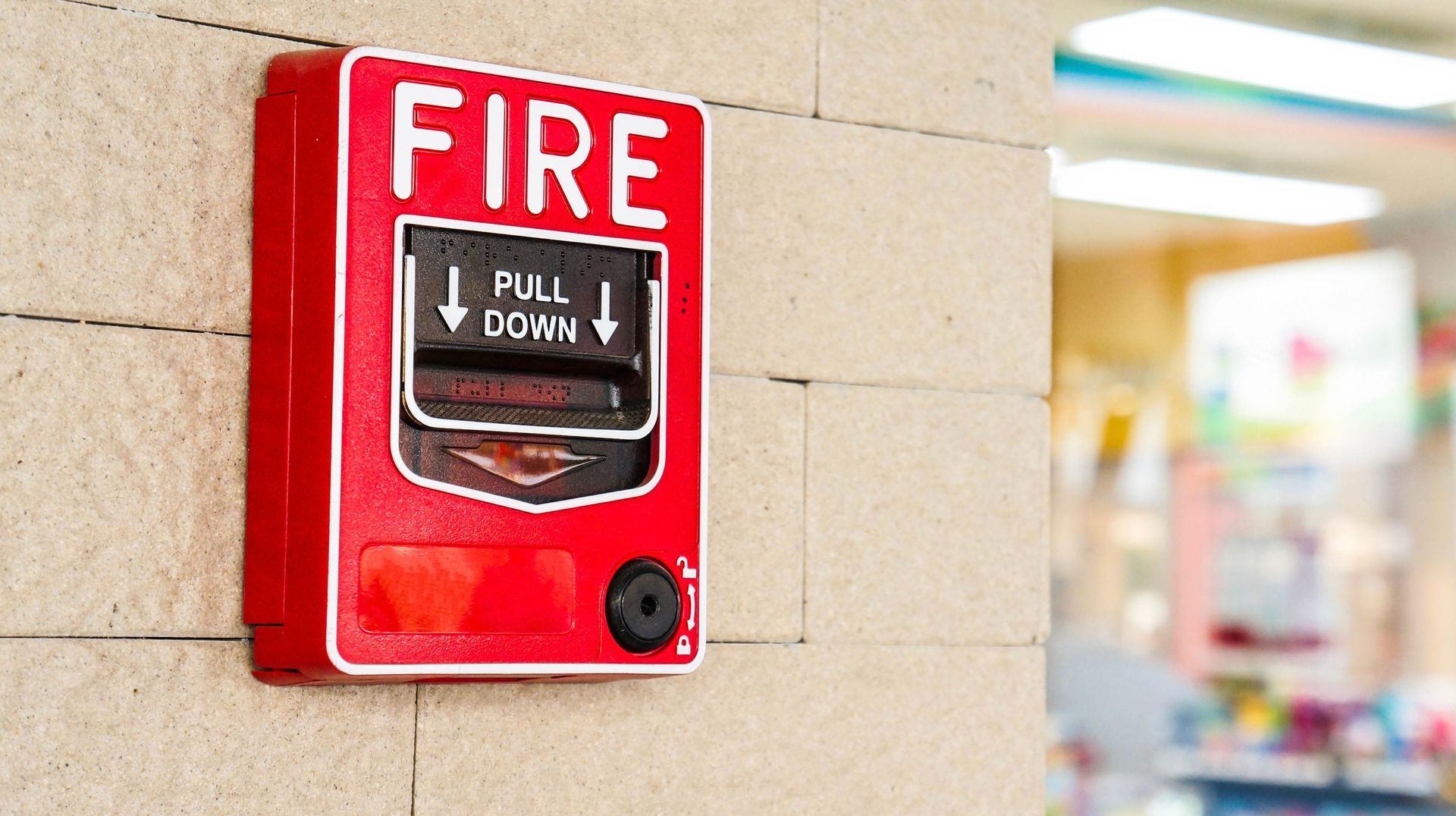 school building with an emergency fire alarm powered by an emergency inverter
