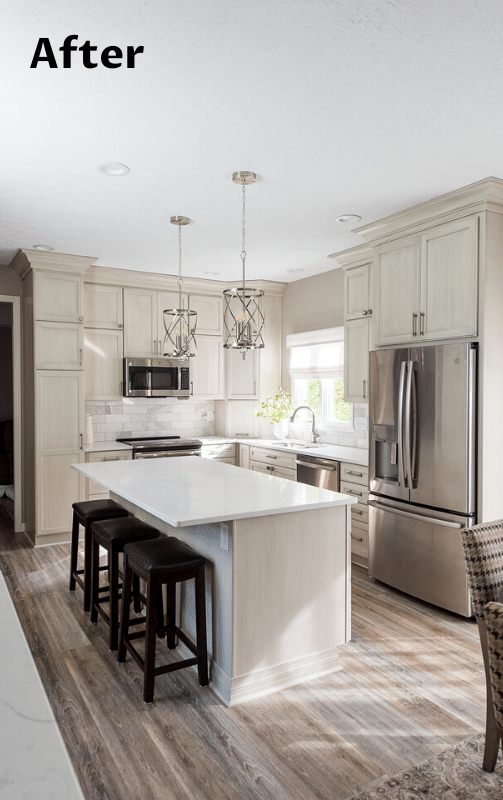 Remodeled kitchen with light cabinets, white countertops, stainless steel appliances, and an island with stools.