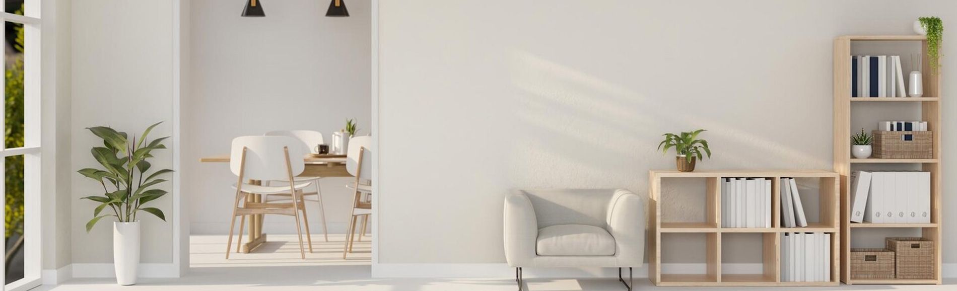Minimalist living room with a white armchair, wooden shelving unit, and potted plants.