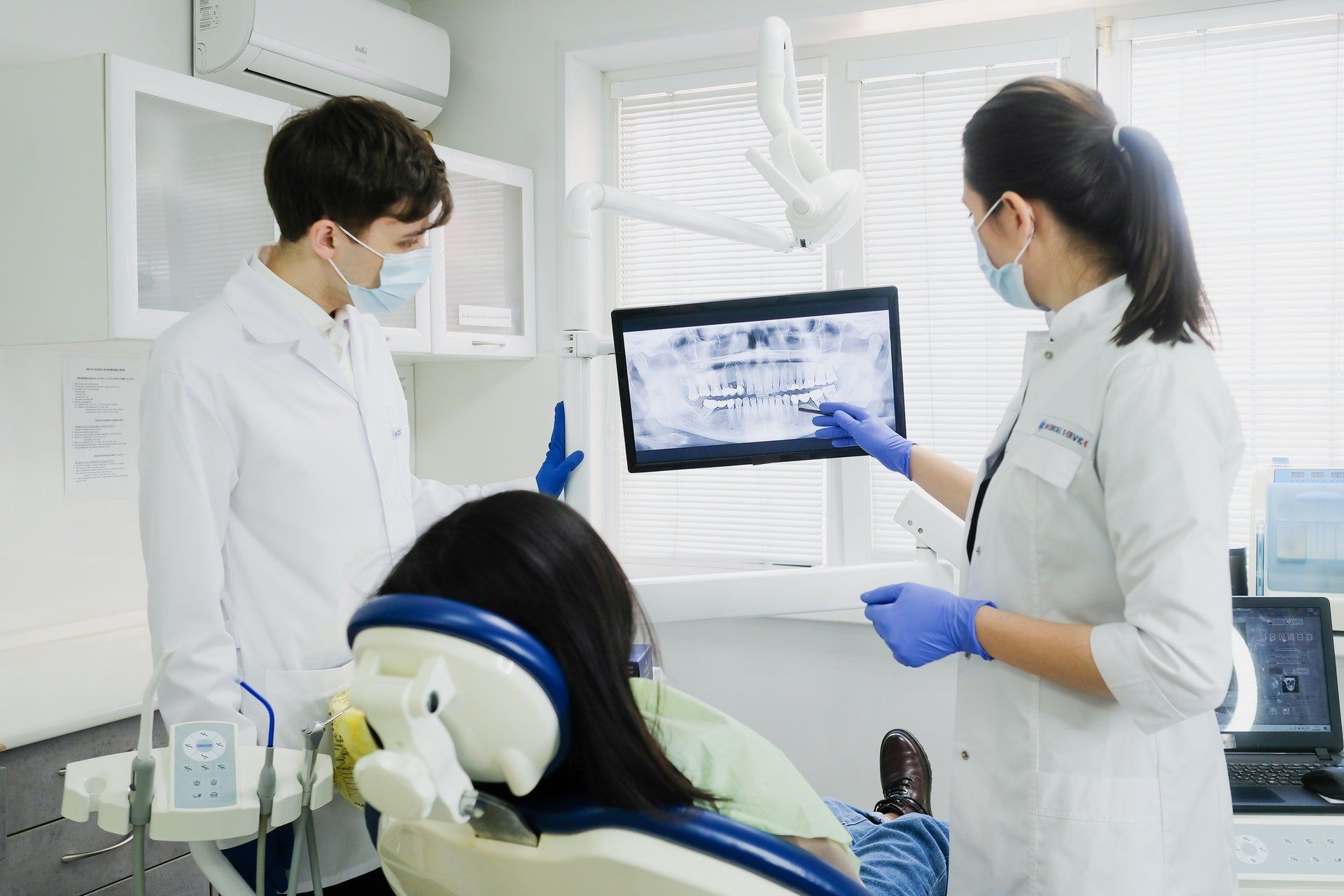 dentist looking at x-ray