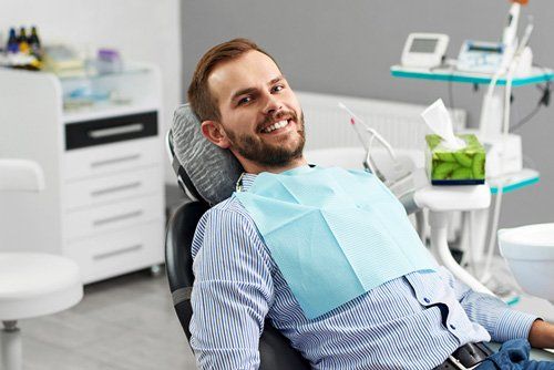 Man in his mid 30's smiling waiting for his dental treatment