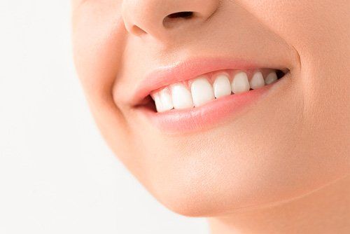 Close up of woman smiling with perfect teeth