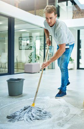 man cleaning floor