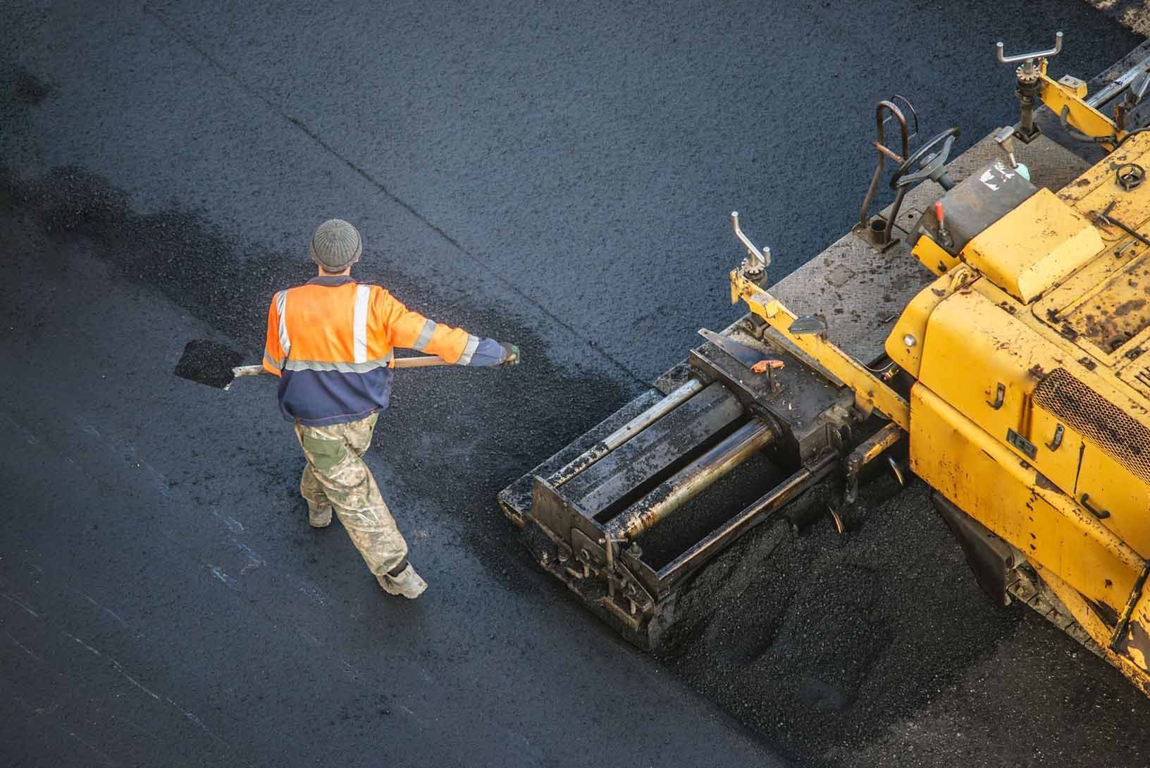 Professional providing asphalt paving services