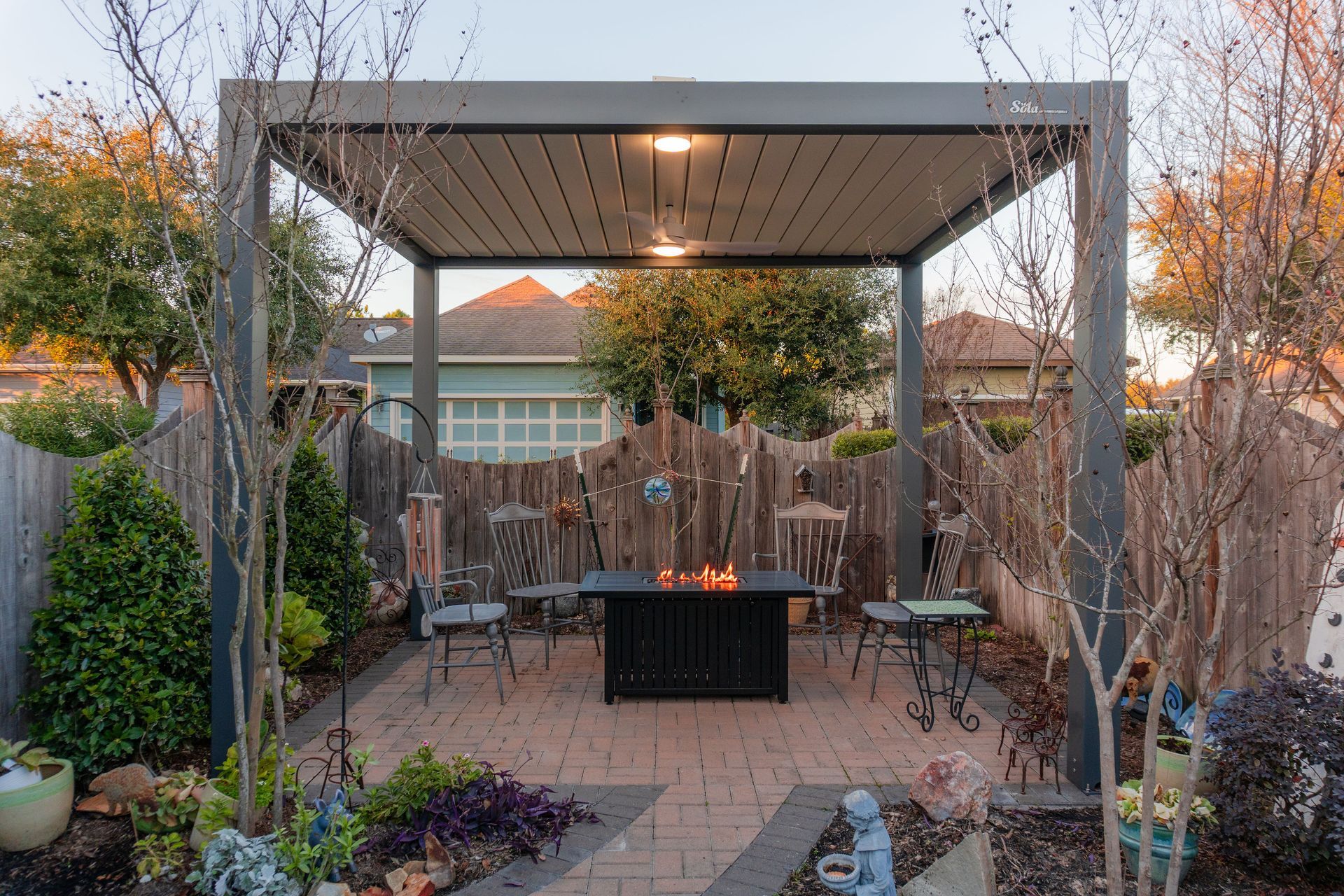 Concrete pillar supports a sign post with electrical conduit attached.