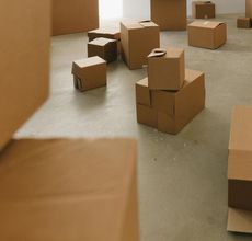 A bunch of cardboard boxes are stacked on top of each other