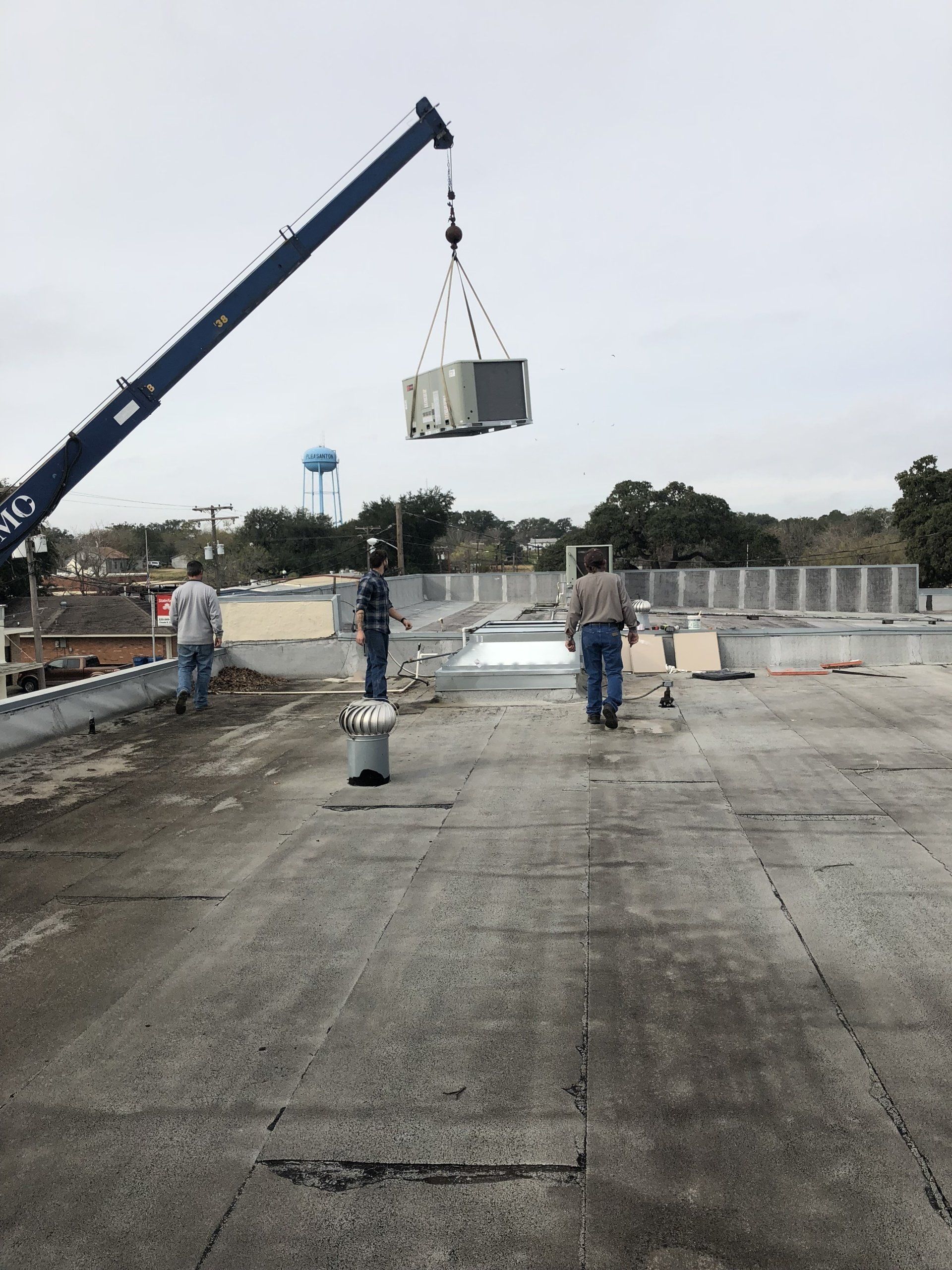 Commercial HVAC Unit On The Crane — San Antonio, TX — P-C Air & Refrigeration