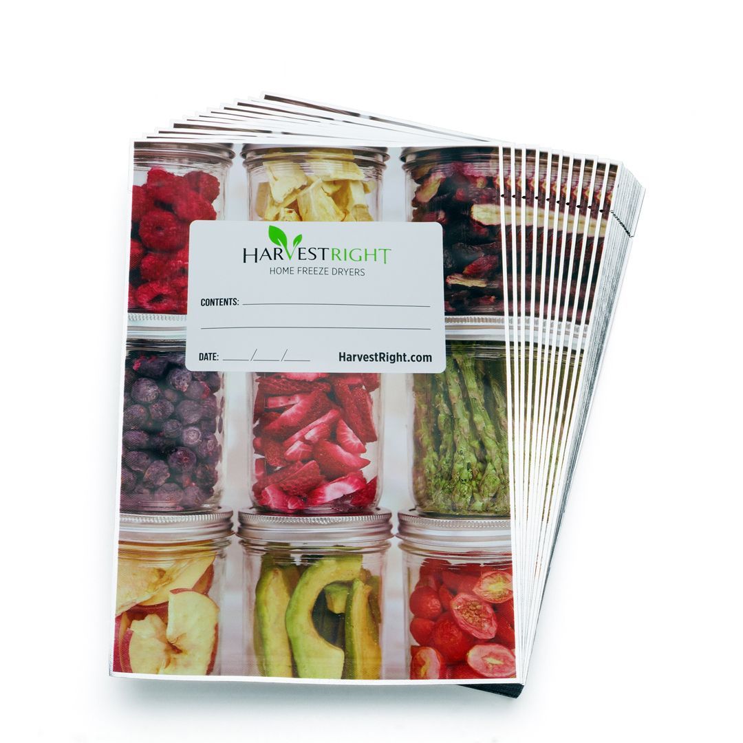 Stack of Harvest Right freeze-dried food labels featuring a colorful grid of preserved fruits and vegetables in glass jars.