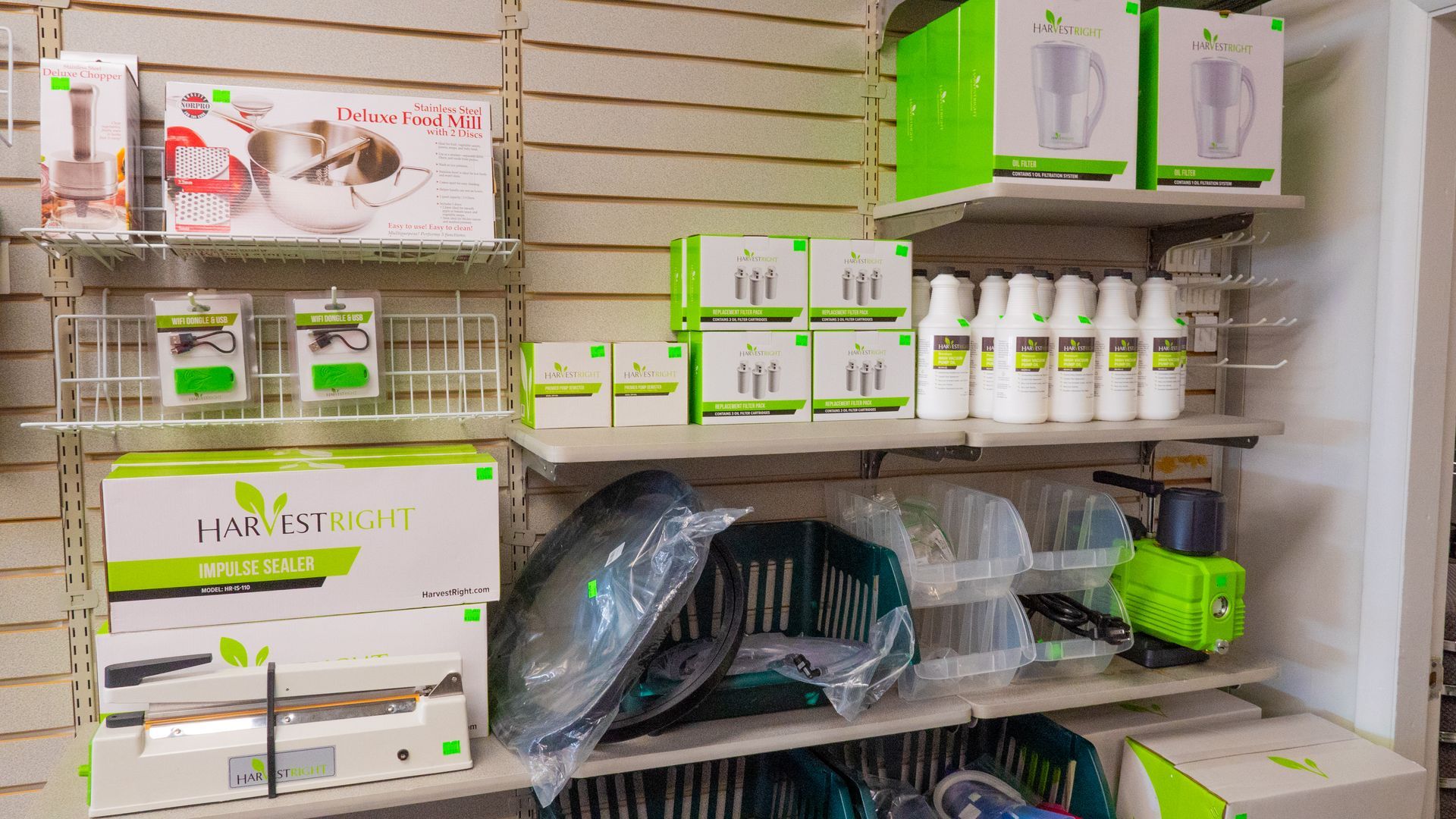 Shelves displaying various kitchen and household products, mostly in green and white packaging.